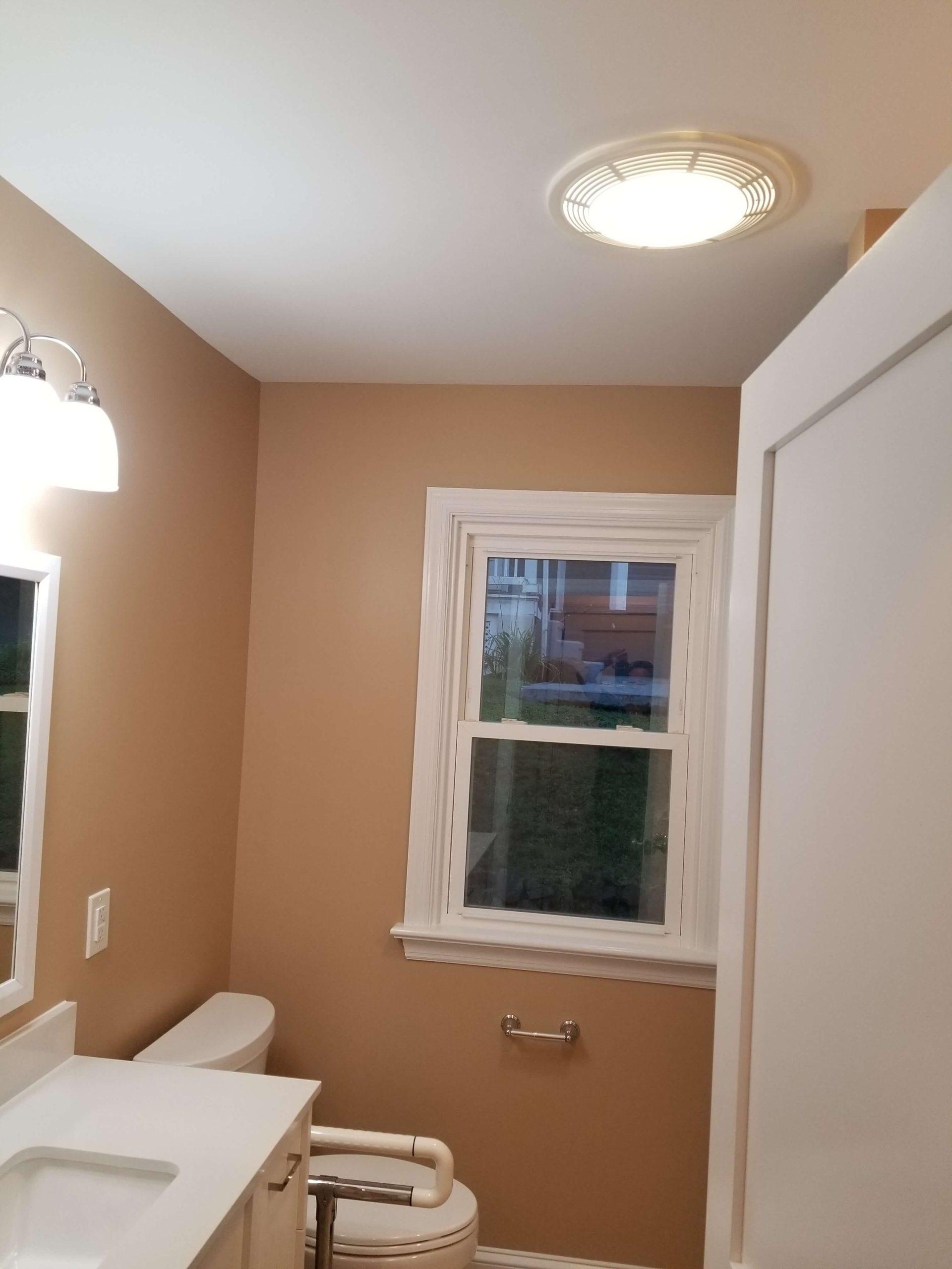 overhead light and refinished windows in a bathroom