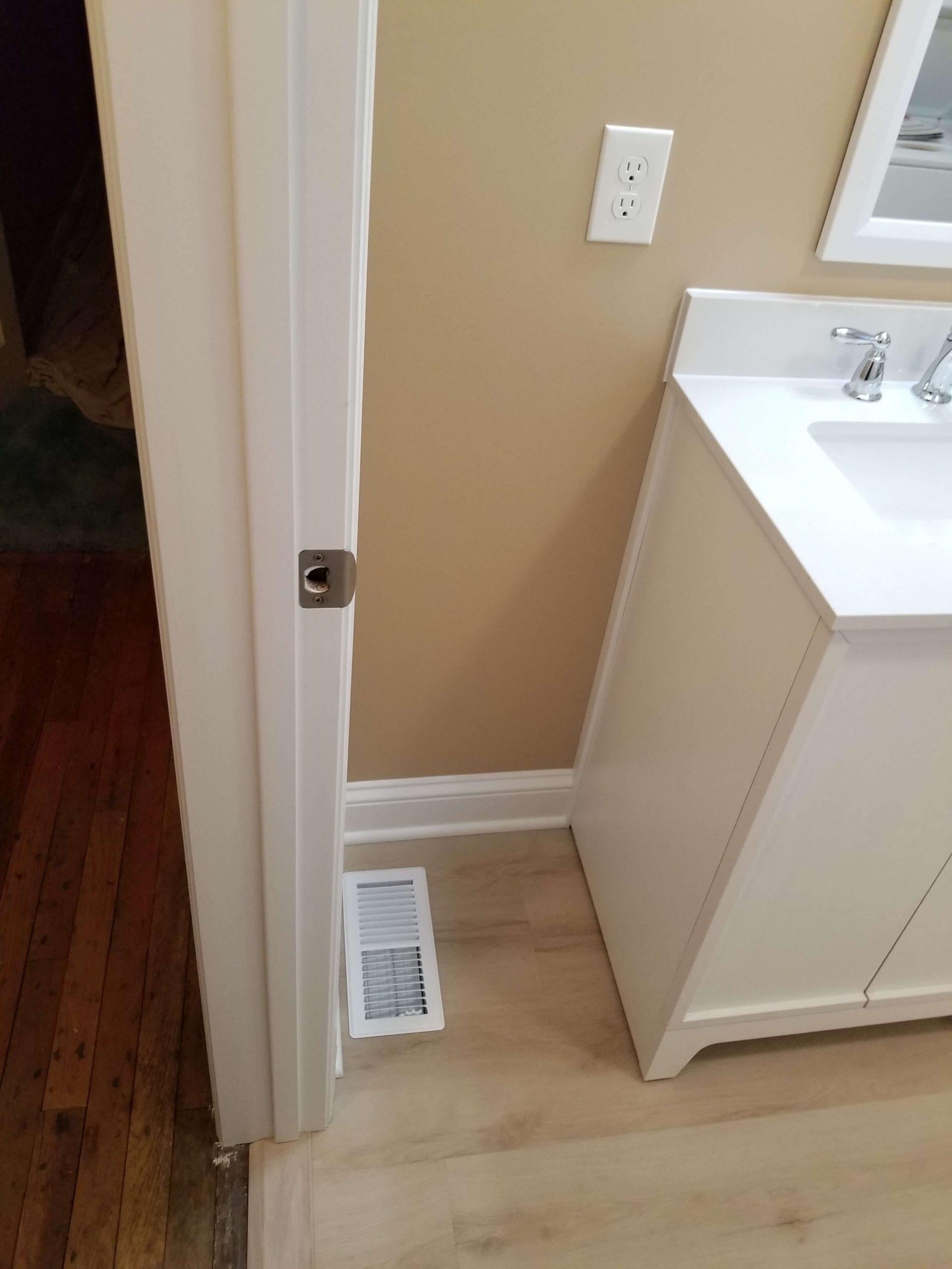 repainted bathroom wall and heat vent
