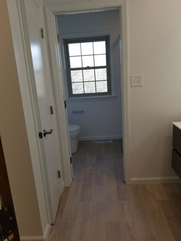 doorway to toilet from Bathroom remodel completed in Reading PA by L&L Services.