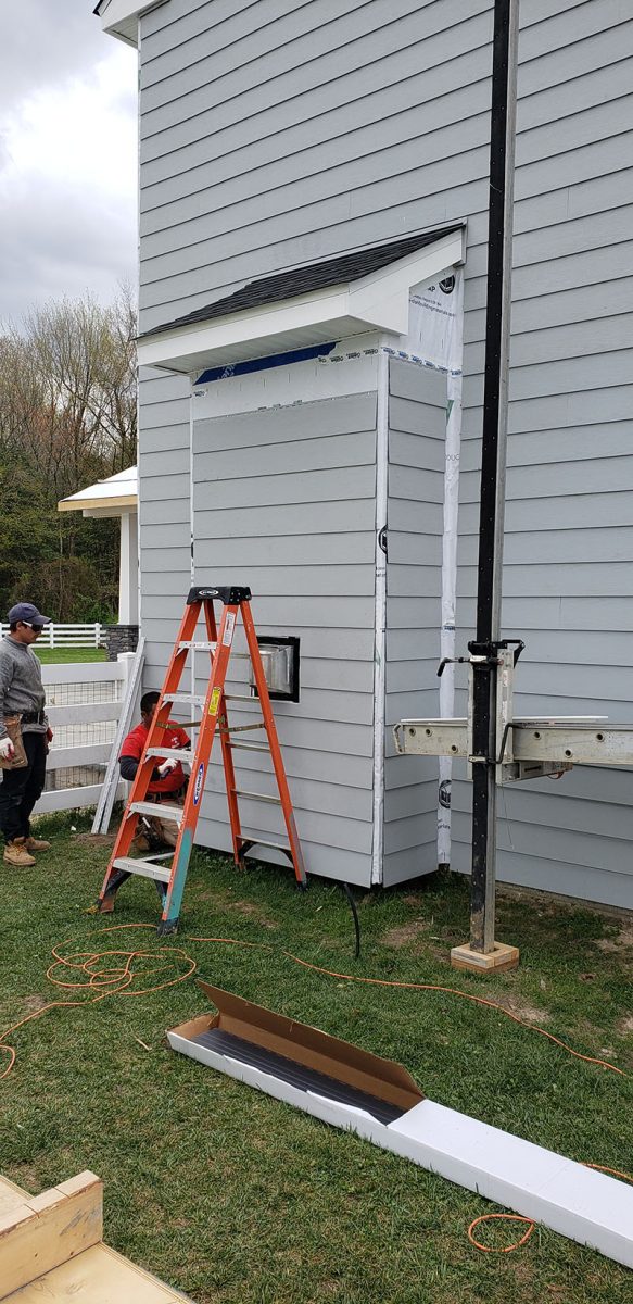 Siding installation on a home in Delaware by L&L Services.
