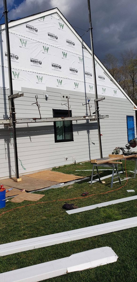 Siding installation on a home in Delaware by L&L Services.