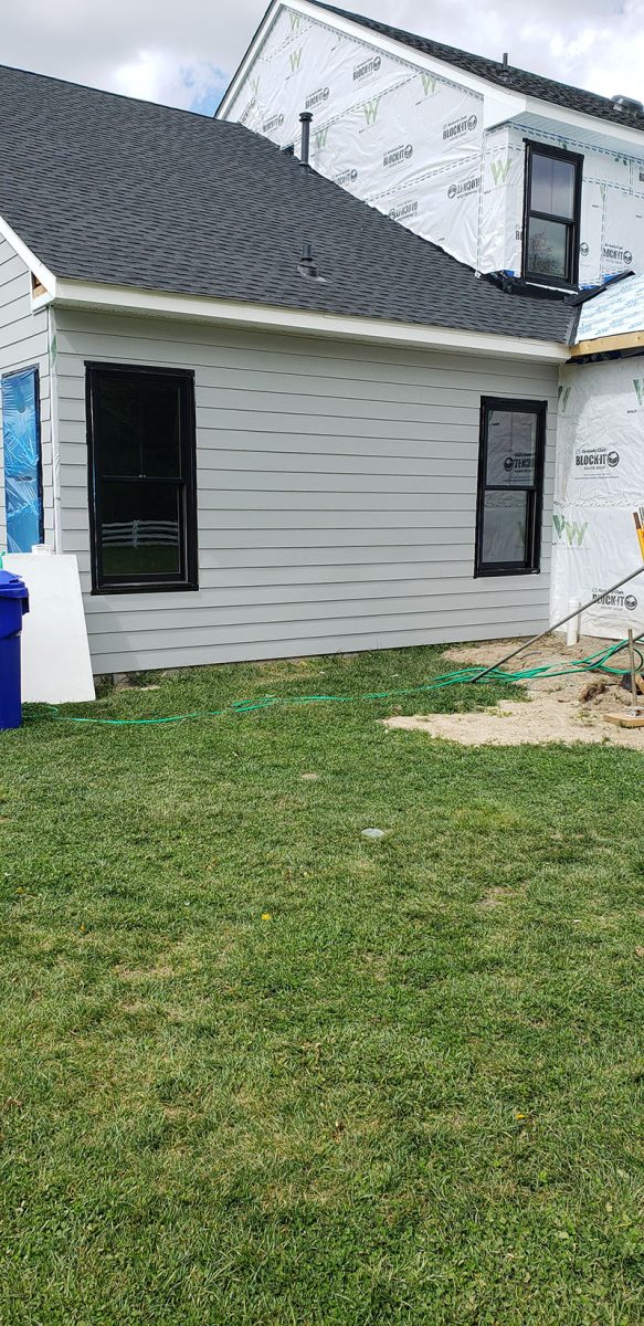 Siding installation on a home in Delaware by L&L Services.