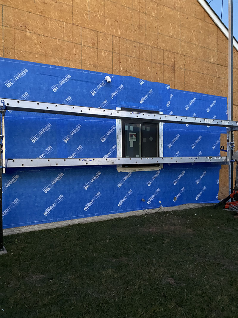 Window Installation on a home in Delaware by L&L Services.