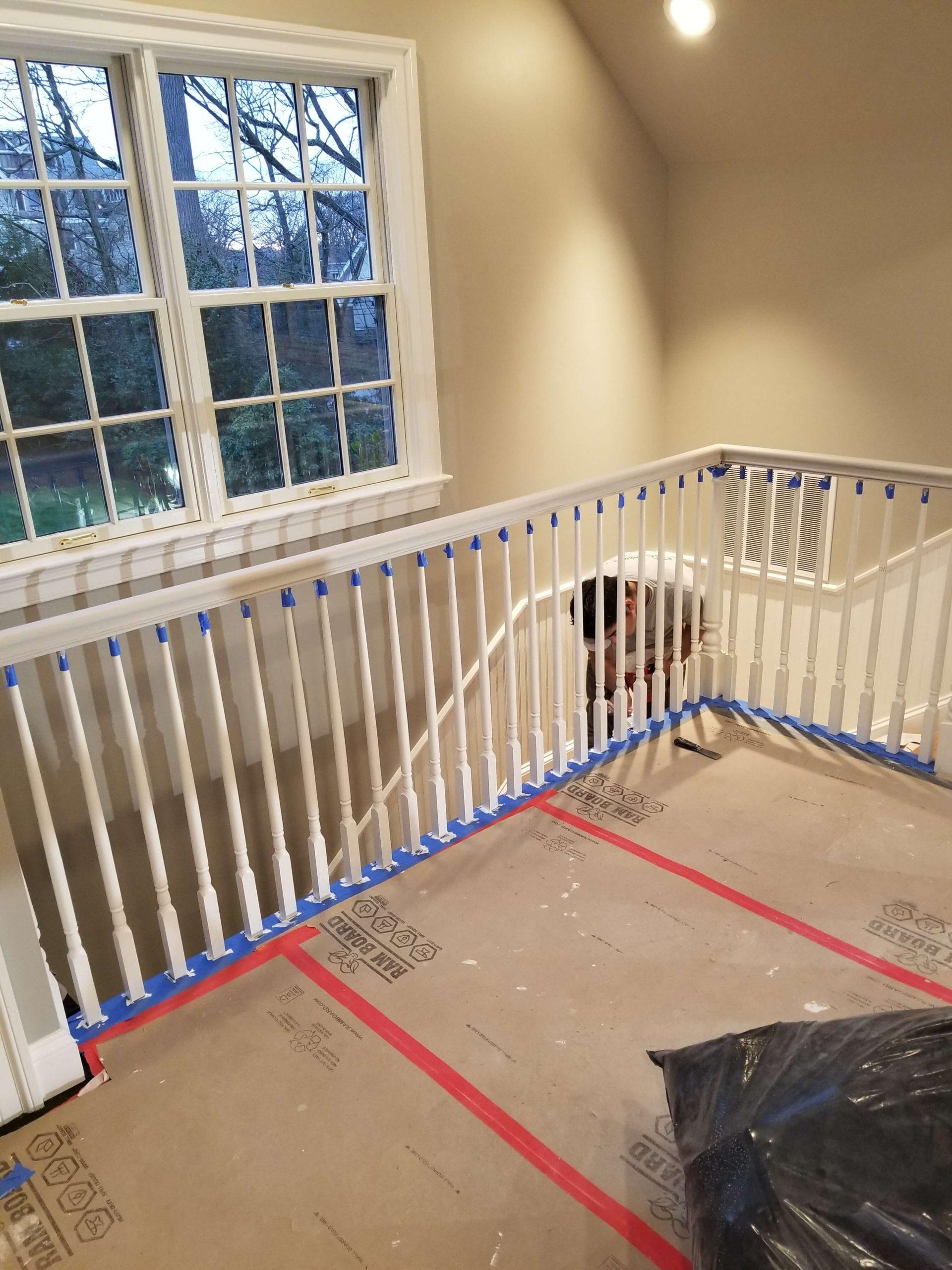 painting the fence around the stairs