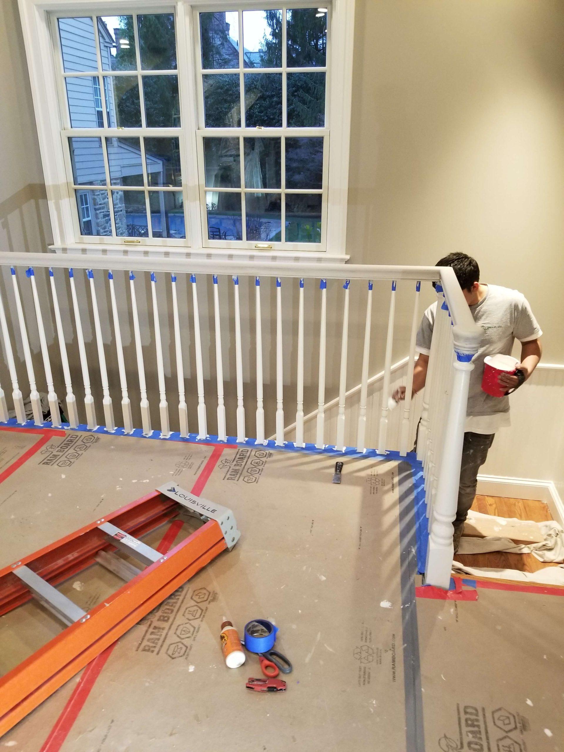 painting the fence around the stairs