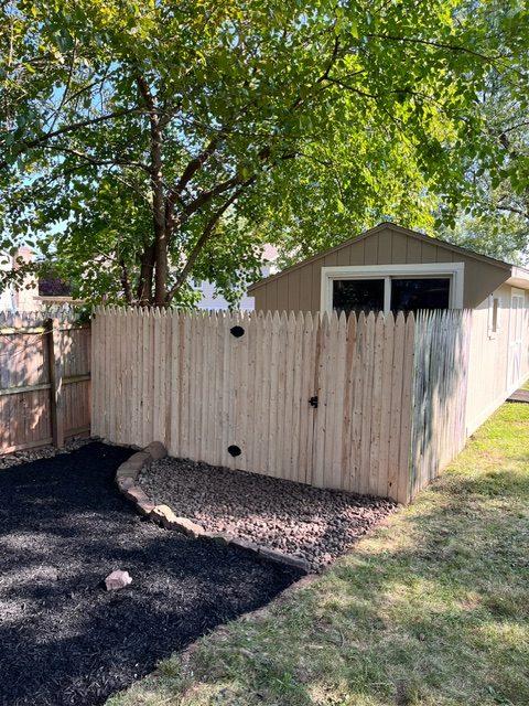 fence access to larger storage shed