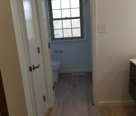 doorway to toilet from Bathroom remodel completed in Reading PA by L&L Services.