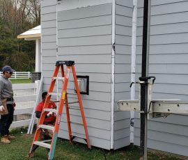 Siding installation on a home in Delaware by L&L Services.
