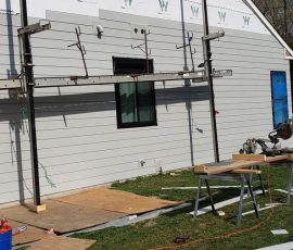 Siding installation on a home in Delaware by L&L Services.