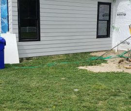 Siding installation on a home in Delaware by L&L Services.