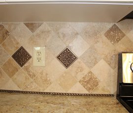 douglassville kitchen remodel close up of yellow diamond backsplash and outlet near the stove