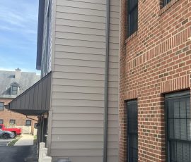 closeup on siding of a two story building