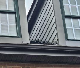 closeup of siding work around upper floor windows
