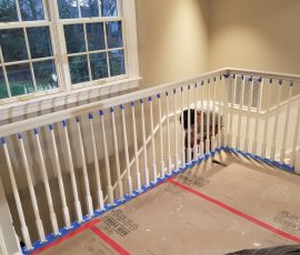 painting the fence around the stairs