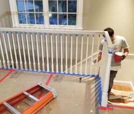 painting the fence around the stairs