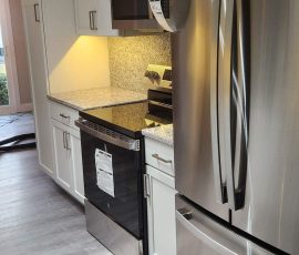newly installed appliances with counters and cabinets